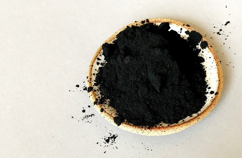 Biobased carbon-negative black pigment